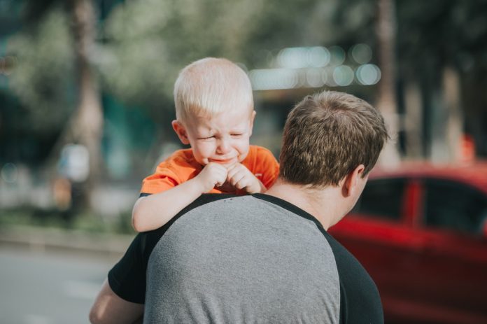 man-carrying-child-1361766